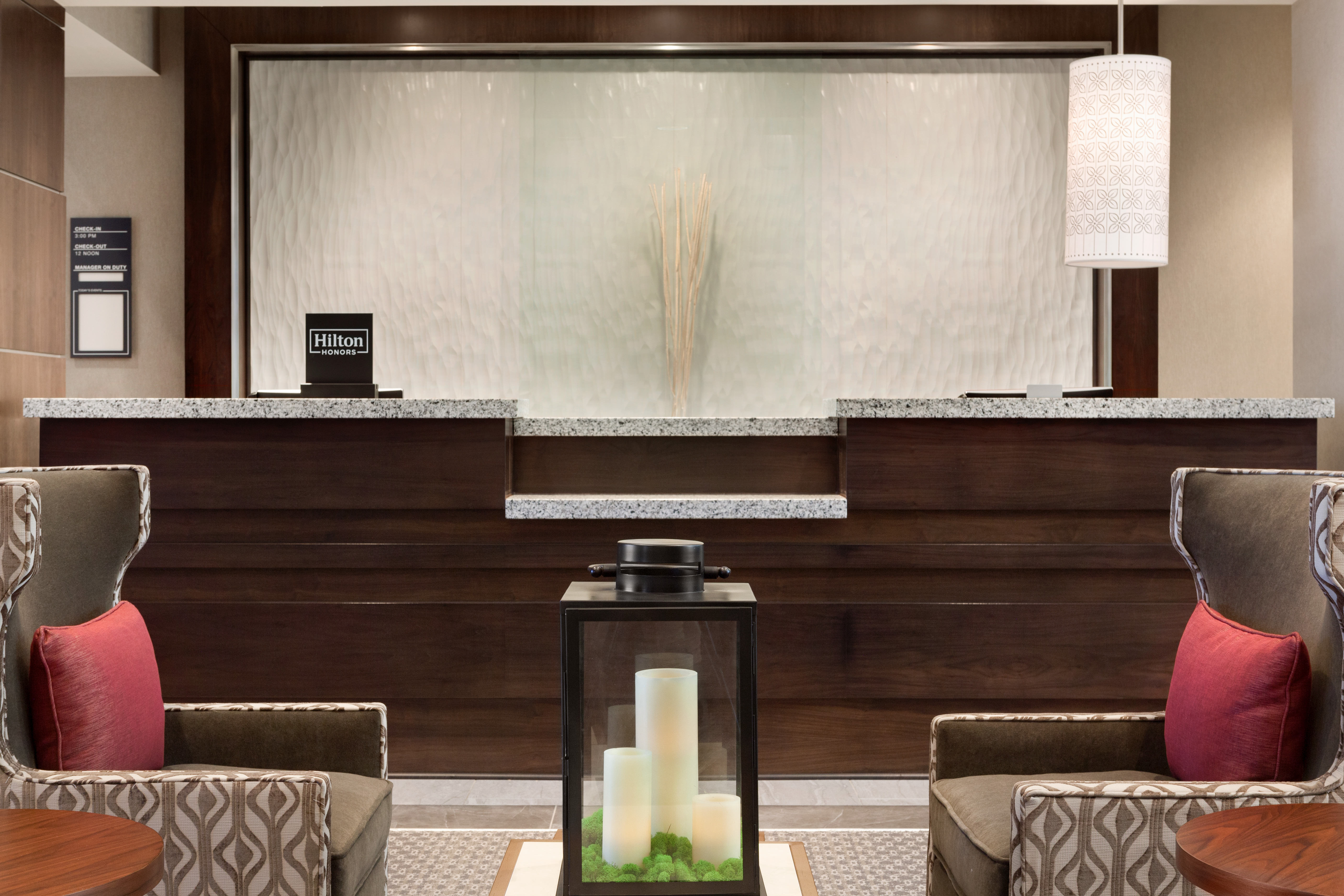 Front Desk Reception Area with Armchairs