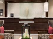 Front Desk Reception Area with Armchairs