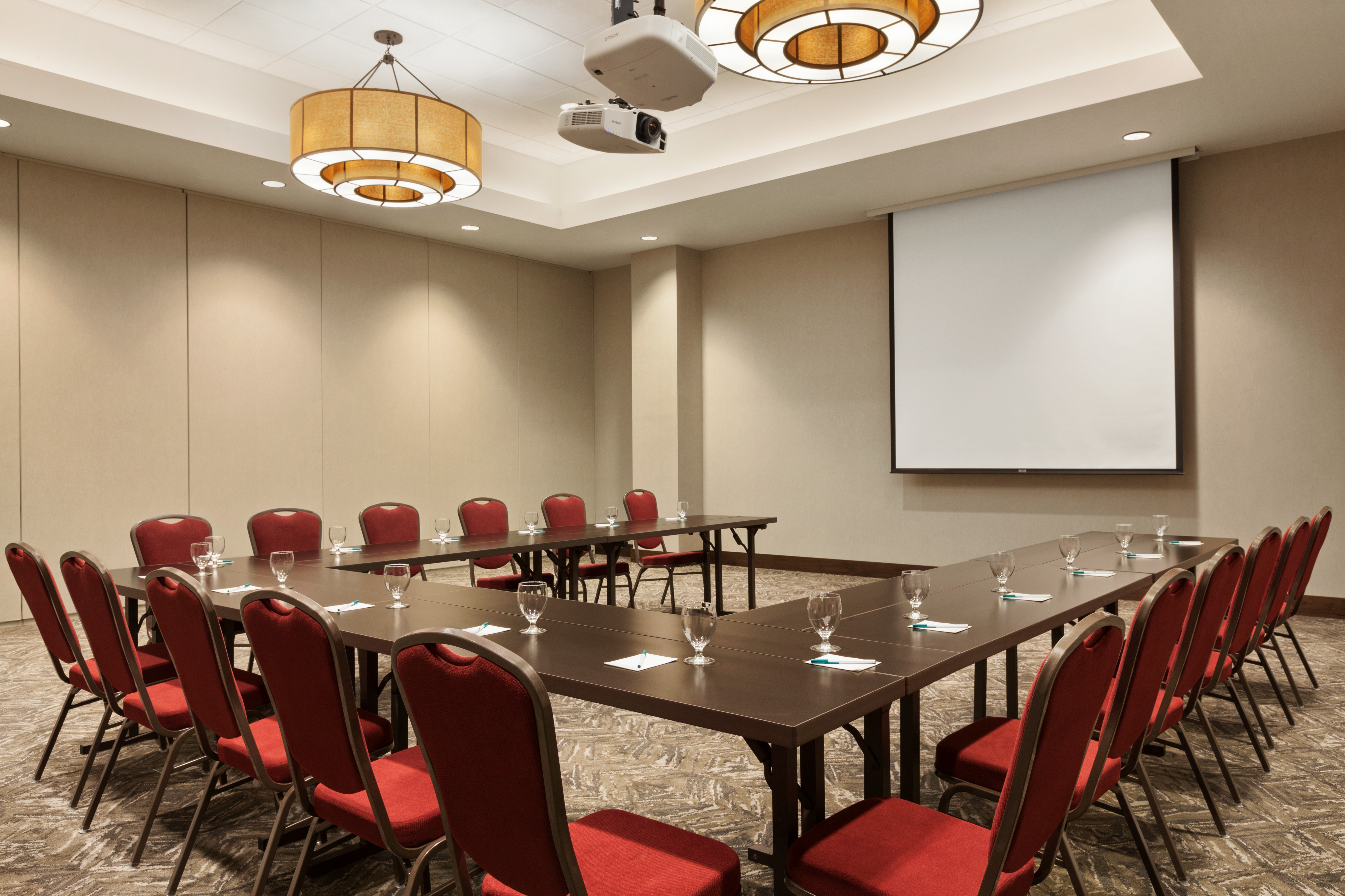 Meeting Room U-Shaped Table Layout with Projector Screen