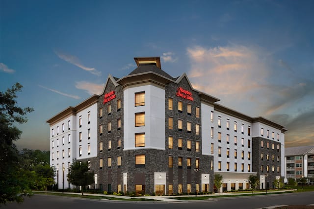 Hampton Inn Charlotte Steele Creek hotel
exterior at dusk