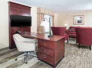 Work Desk, Chair, Flat Screen TV, and Lounge Seating in King Large Studio Guest Room
