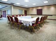 U-Shaped Table Setup and Chairs in Meeting Room