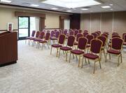 Meeting Room with Chairs Facing Lectern at Front of Room