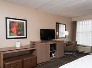 One King Bed Guest Suite with HDTV and Work Desk