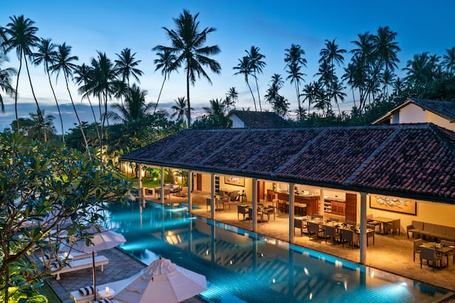 Outdoor swimming pool with loungers