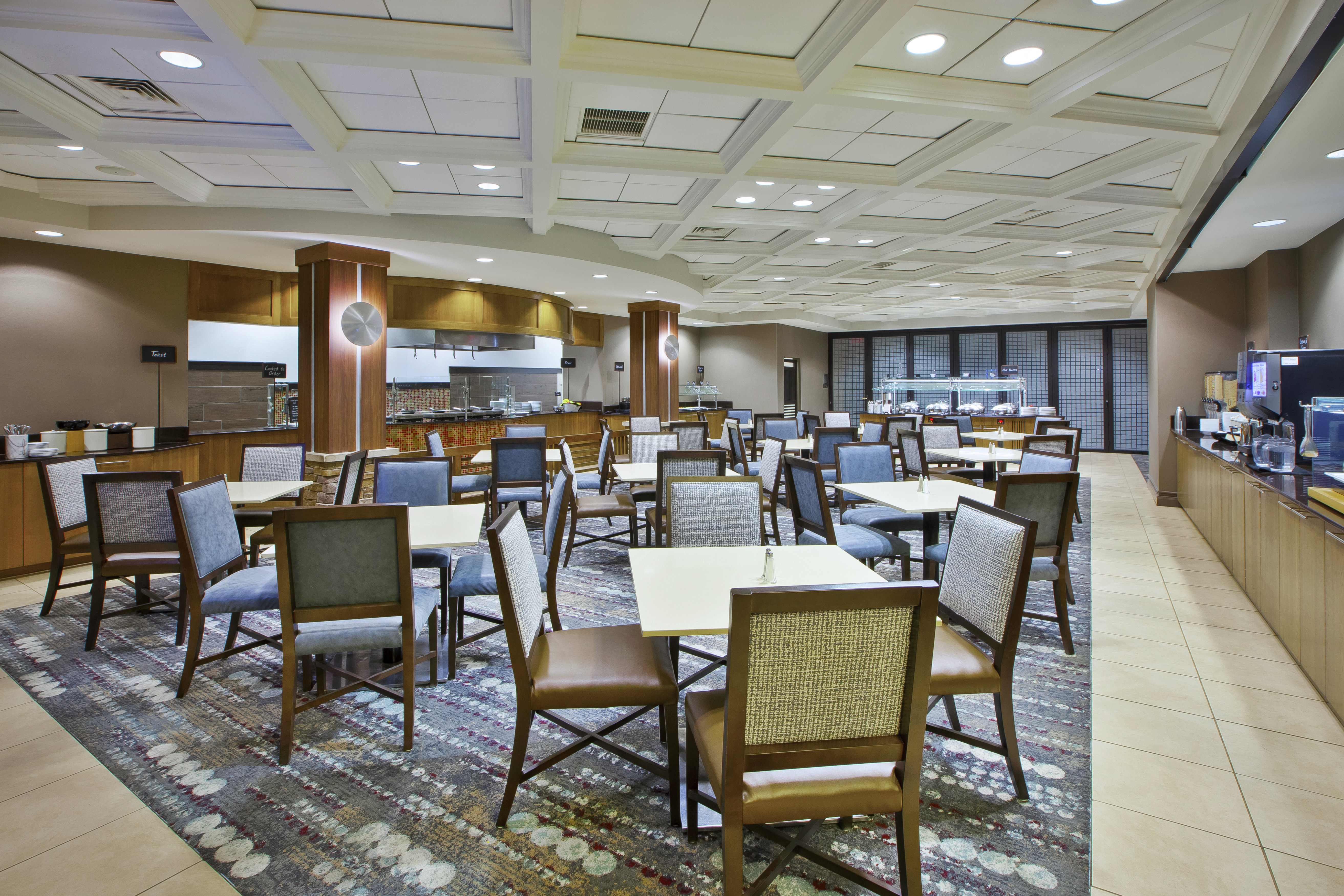 Tables, Chairs and Food Service Area in Breakfast Dining Area