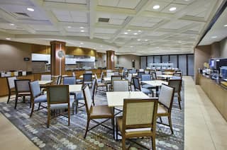 Tables, Chairs and Food Service Area in Breakfast Dining Area