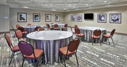 Gahanna Room Arranged Cabaret Style Tables and Chairs Facing TV