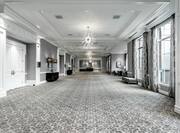 Hotel foyer with large floor-to-ceiling windows