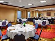 Spacious Ballroom Area with Banquet Setup, Roundtables and Chairs