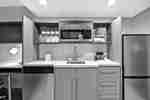 Suite Kitchen with Microwave and Kitchen Utensils
