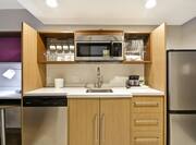 Suite Kitchen with Microwave and Kitchen Utensils