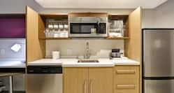 Suite Kitchen with Microwave and Kitchen Utensils