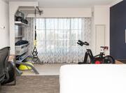 Guest Room with Exercise Equipment and Work Desk
