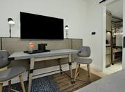 Guestroom With Desk And TV