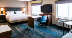 Large Bed Desk Area and HDTV in Junior Suite