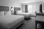 Guest Room with Two Comfortable Beds and Work Desk