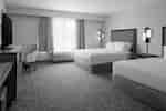 Guest Room with Two Comfortable Beds and Work Desk