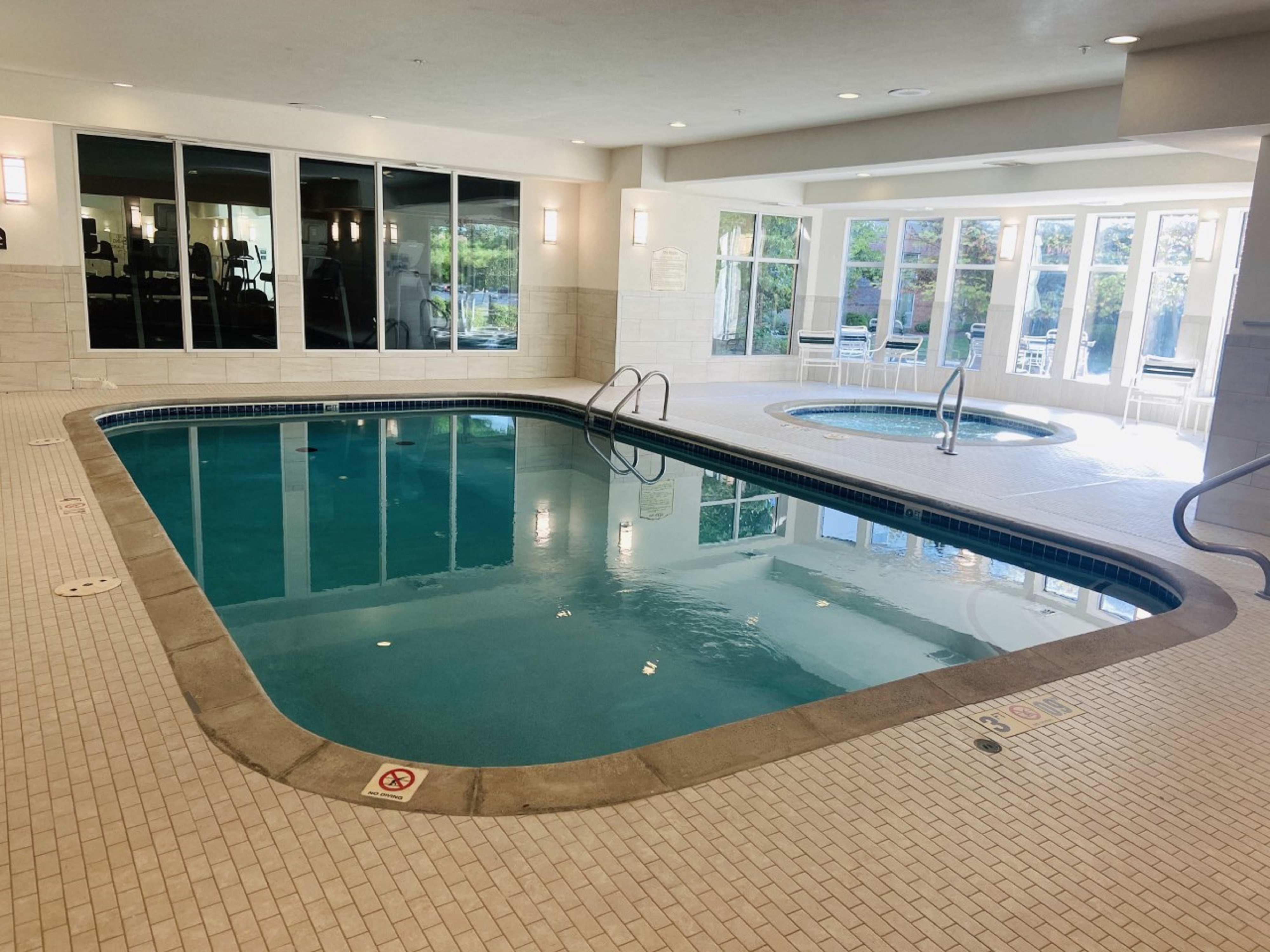 Indoor Pool and Whirlpool Area with Large Windows