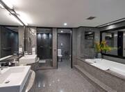 Dual Vanity Area and Bathtub in Bathroom