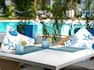 outdoor table by pool