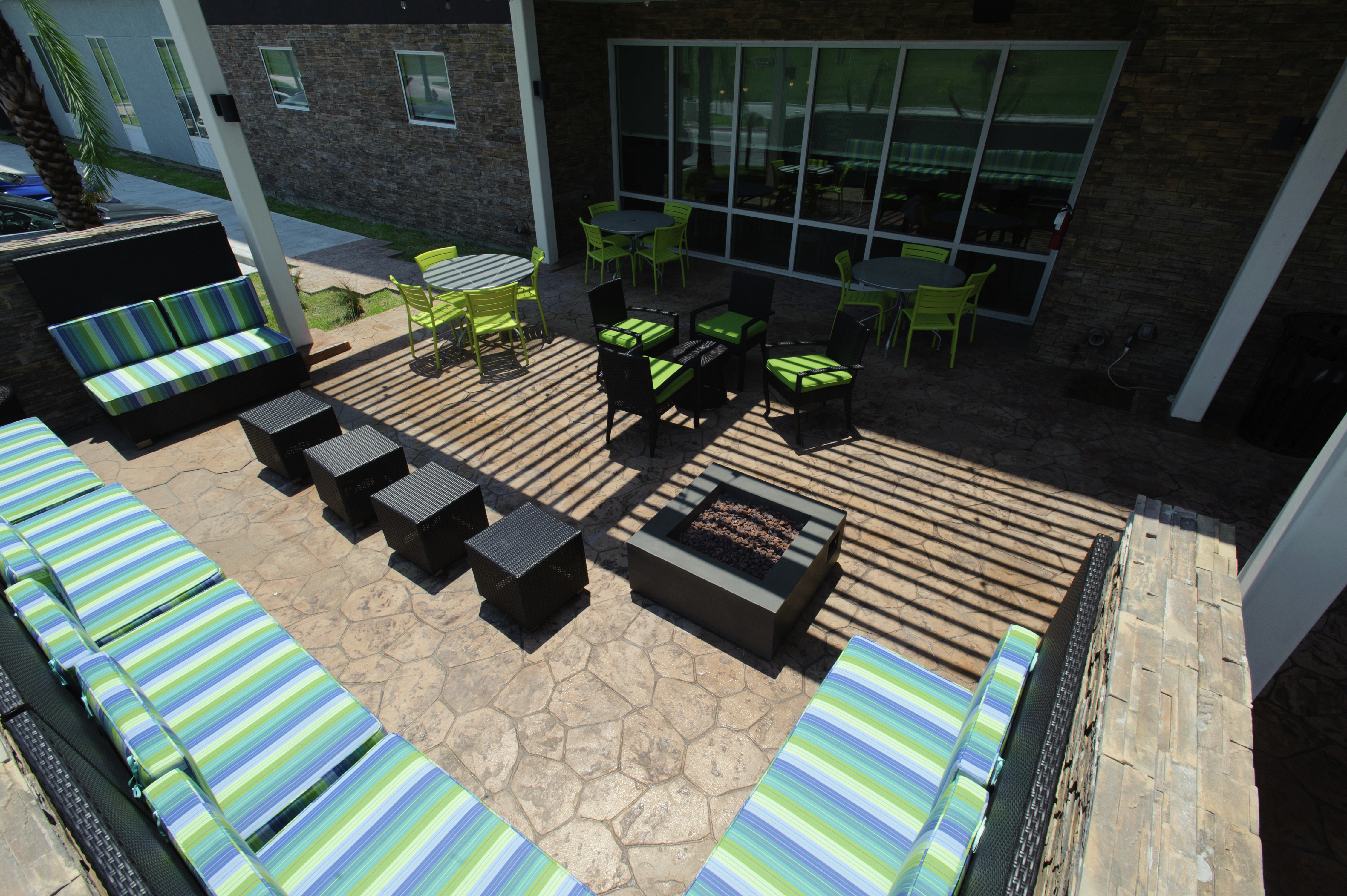 Outdoor patio with lounge seating and tables