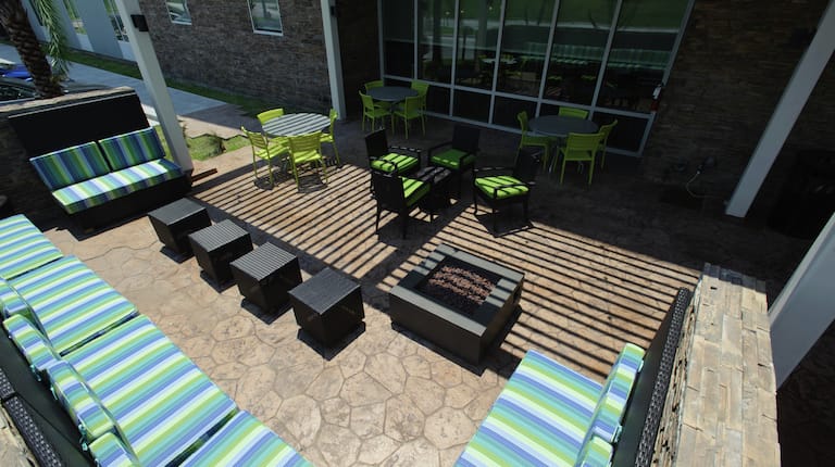 Outdoor patio with lounge seating and tables