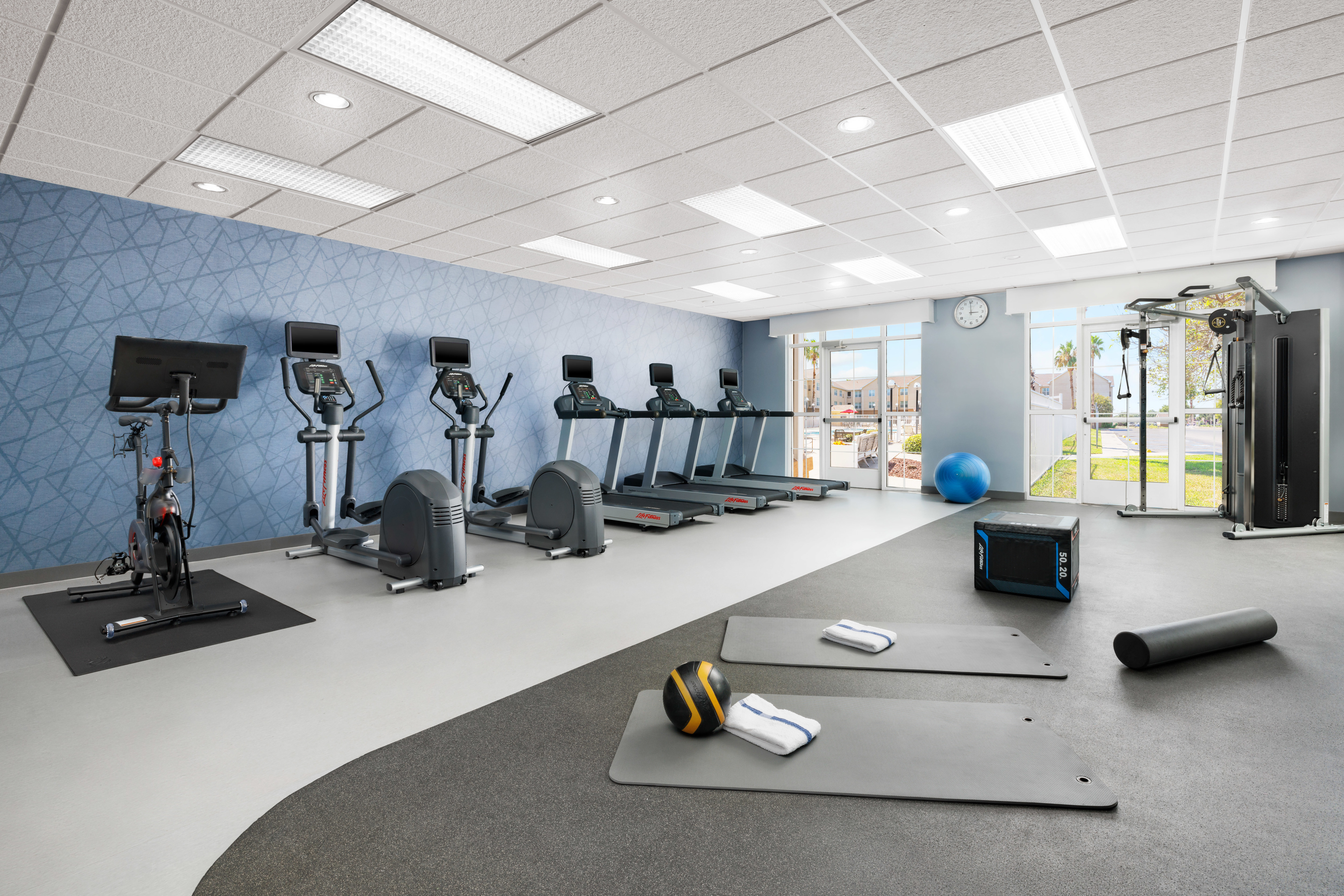 on site fitness center, Peloton bike, ellipticals, treadmills, yoga mats
