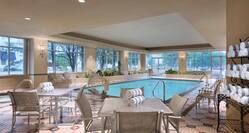 Indoor Pool with tables and chairs