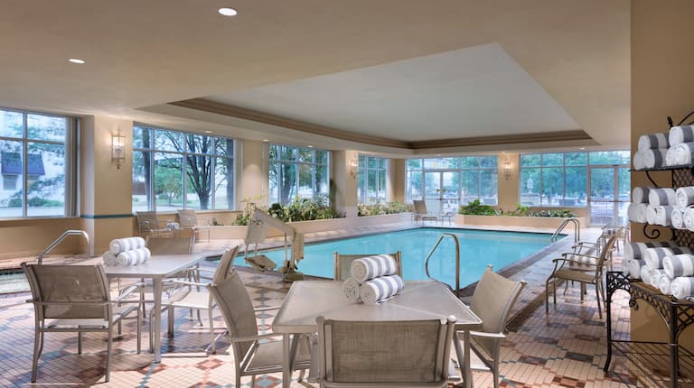Indoor Pool with tables and chairs