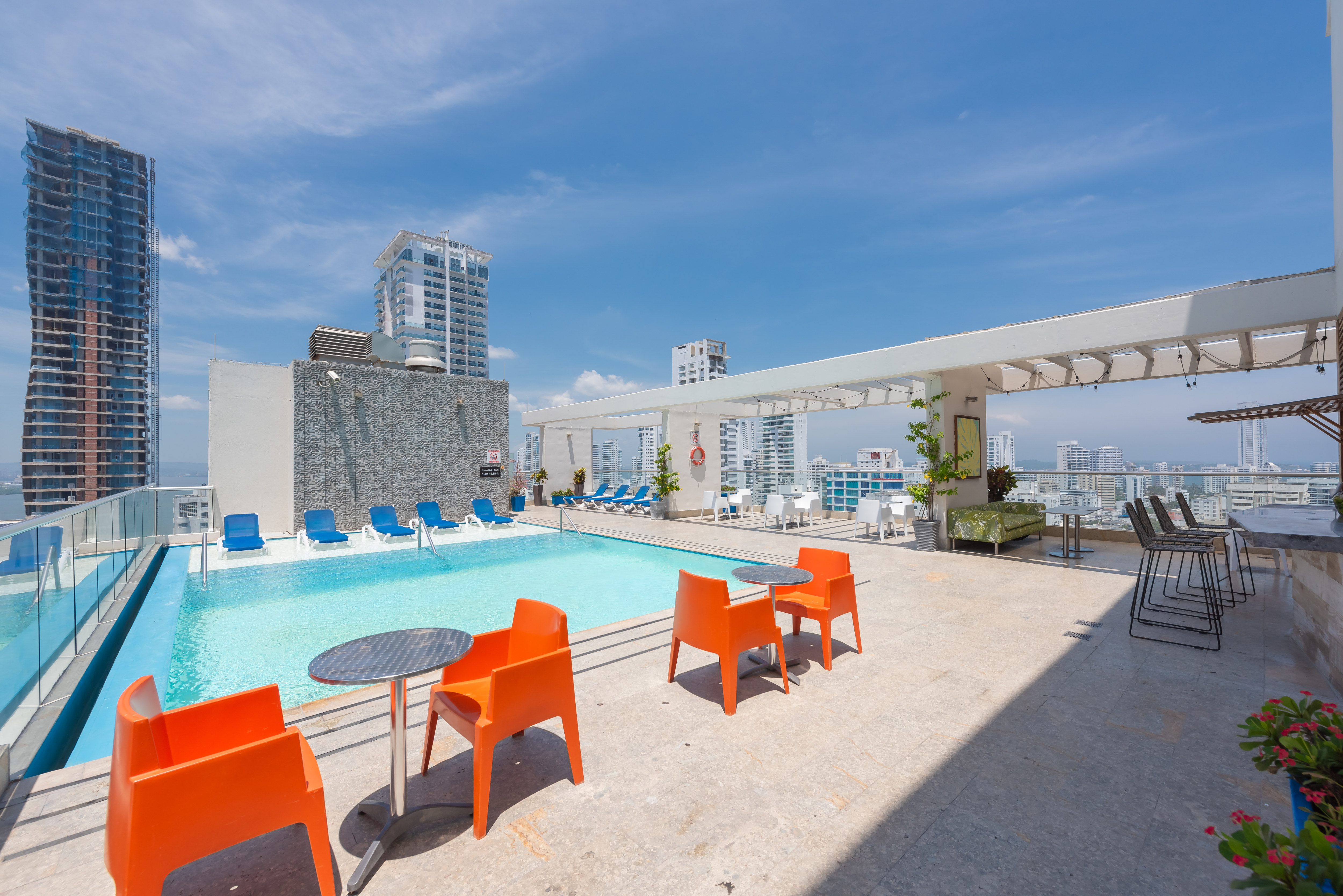 Seats by Outdoor Pool Area with City View