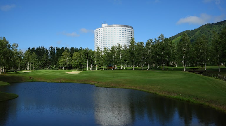 Golf course with hotel exterior