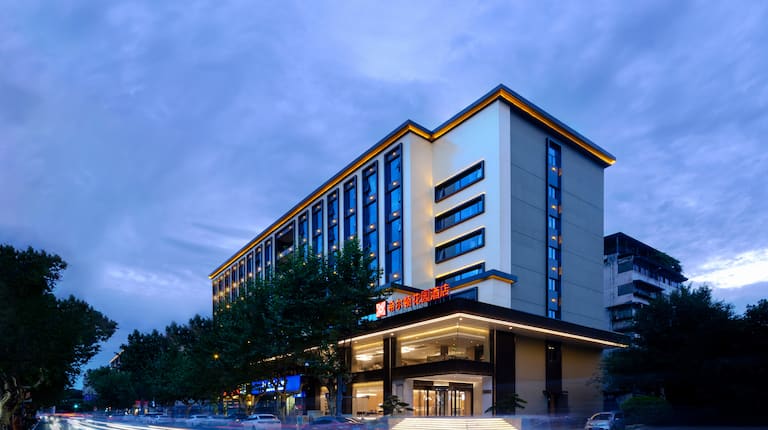 Exterior of hotel building at dusk