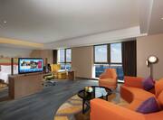 Hampton Suite with Kingbed, TV, work desk, lounging area and city views