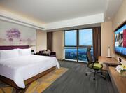 King Superior Room with work desk, TV, lounging area and outside views