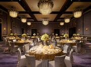 Spacious Grand Ballroom with Round Tables and Chairs