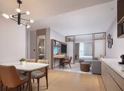 Suite with lounge area and kitchen with dining table