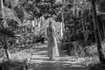 Woman in pink dress walking in spa groundsthrough S