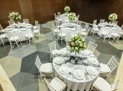Round Tables Set for Formal Dinner in Meeting Room