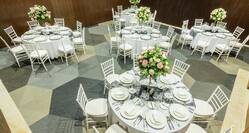 Round Tables Set for Formal Dinner in Meeting Room