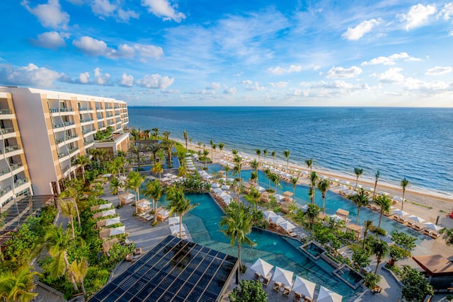 aerial view of outdoor pools and ocean