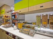 Complimentary Breakfast Buffet Area with Cereals Selections