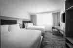 Two Beds and TV in a Guest Room