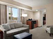 Executive Suite with Lounge Area, Faucet, and Room Technology