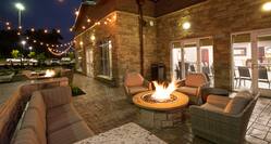 Evening View of Seating Area of Outdoor Patio with Fire Pit