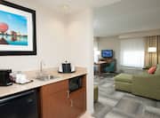 Mini-Fridge, Coffee Maker, Sink and Microwave with Opening to Living Area in 2 Queen Studio Suite