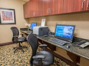 Business Center with Wall Art, Two Computer Workstations with Chairs, Printer/Fax./Copier, and Telephone