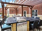 Grill Station and Dining Tables in Outdoor Patio Area