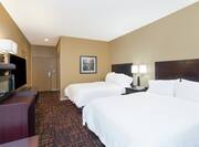 Two Double Bed, Hospitality Center, TV, and Entry in Hearing Accessible Room