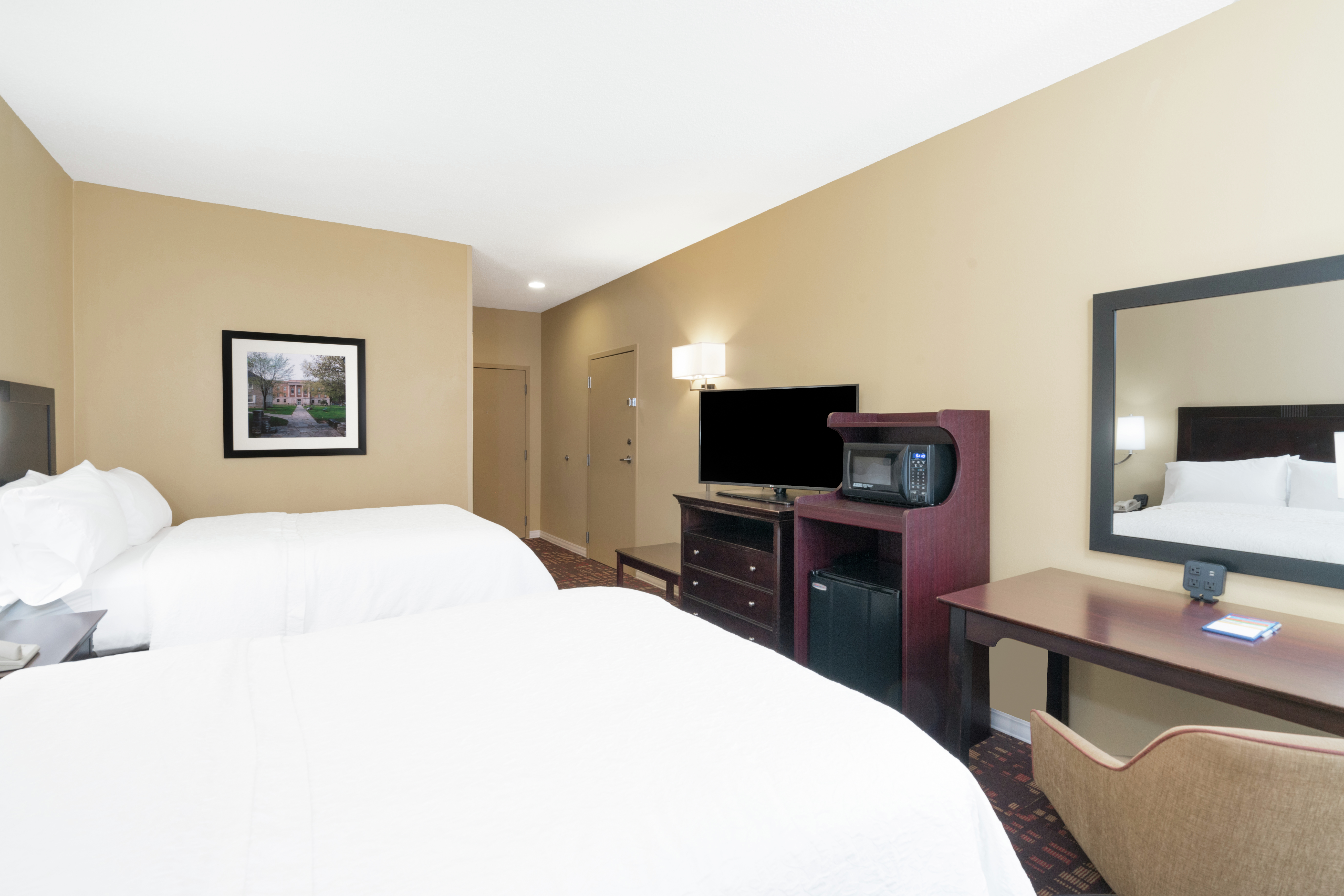 Two Double Beds, Entry, TV, Hospitality Center, and Work Desk in Guest Room